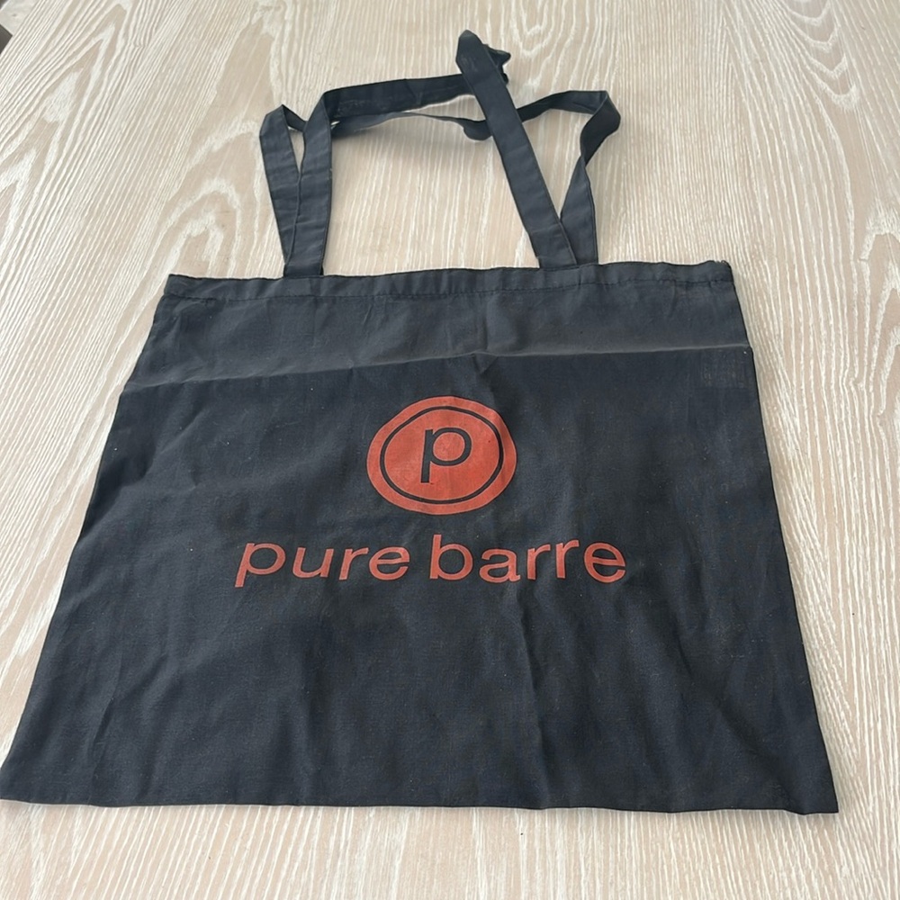 Pure Barre black and orange logo shopping tote bag